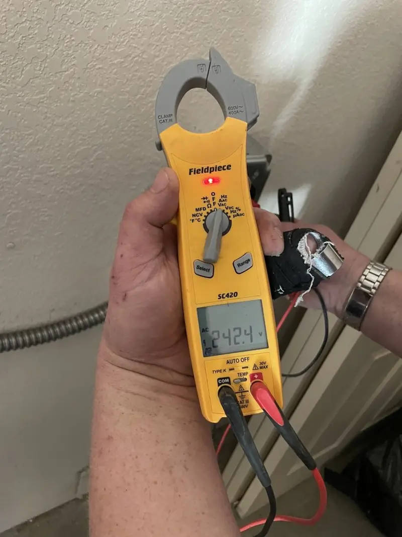 Voltage testing with clamp meter during Generator Installation in Greendale